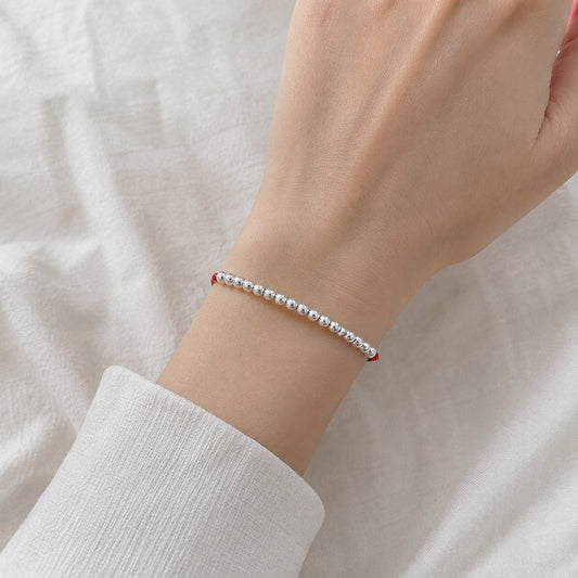Pulsera de Perlas de Plata en Hilo