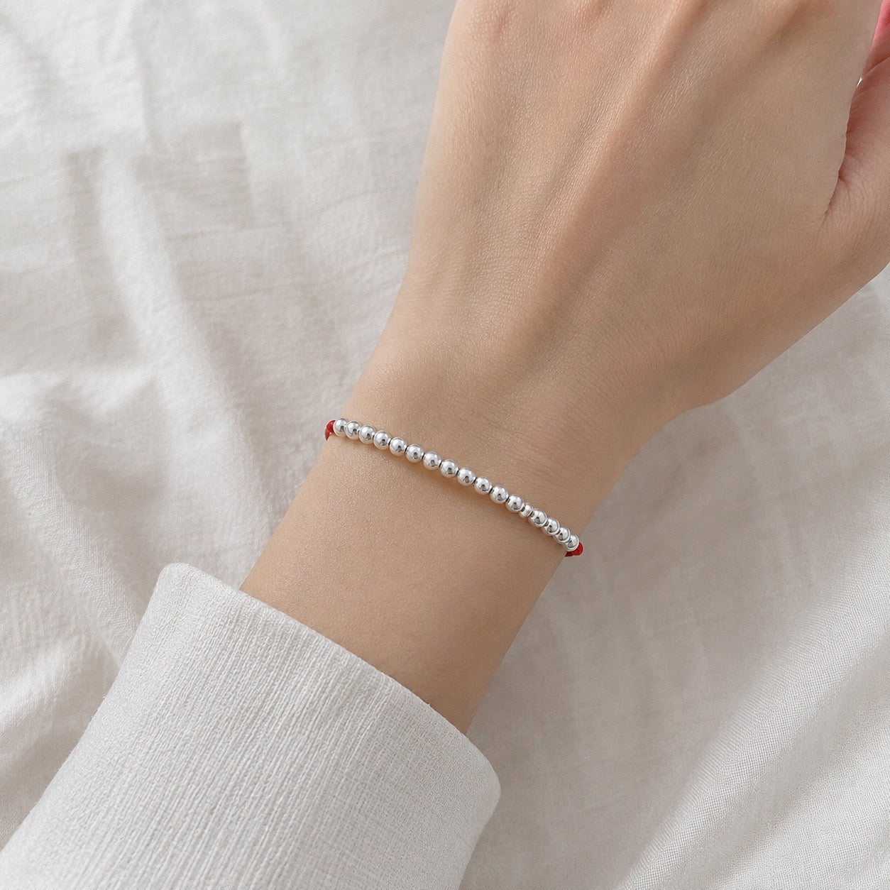 Pulsera de Perlas de Plata en Hilo